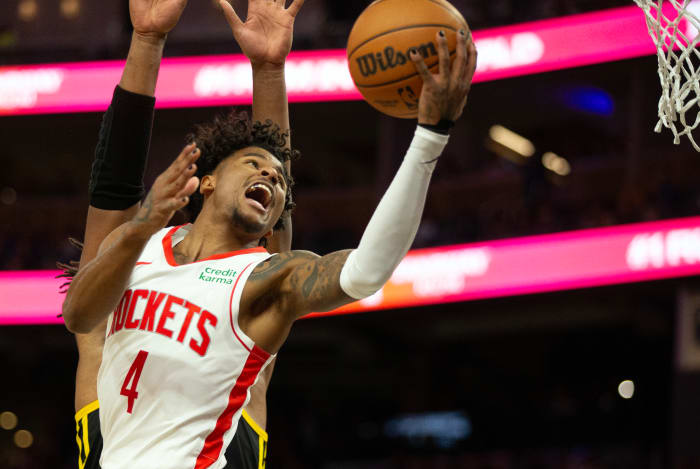Rockets guard Jalen Green drives against Golden State Warriors forward Kevon Looney (5) during the third quarter at Chase Center.